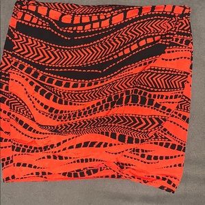 Orange and black wrap Bebe skirt.